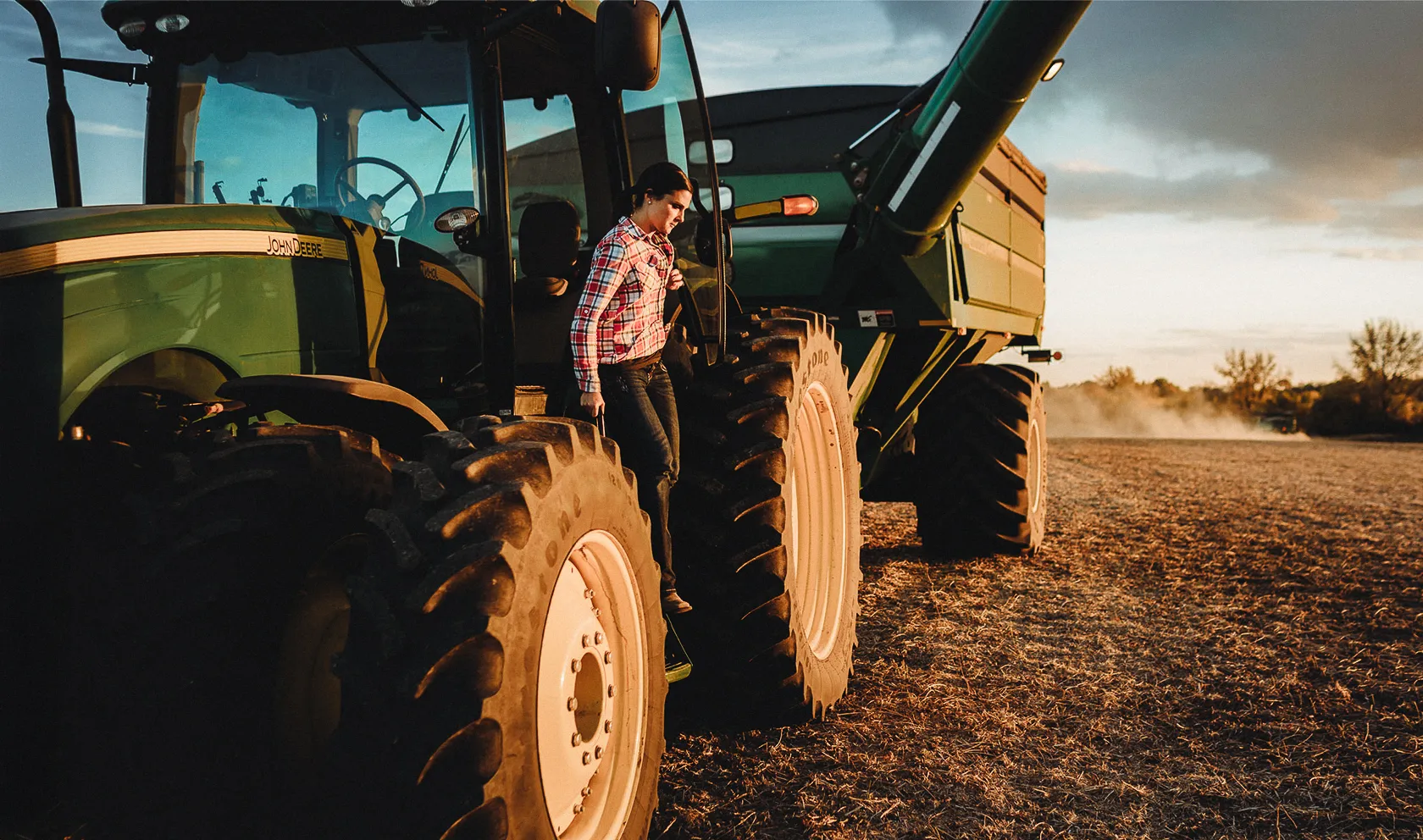 green tractor with wagon cart