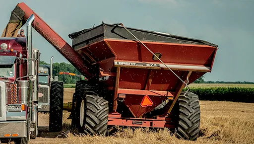 red grain wagon in field